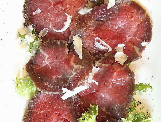 ANGUSPURE BEEF CARPACCIO ON CURLY ENDIVE