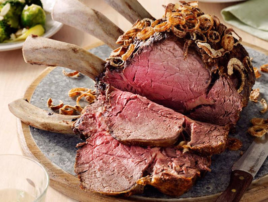STANDING BEEF RIB ROAST WITH SMOKED CHEDDAR & CHIVE MASH